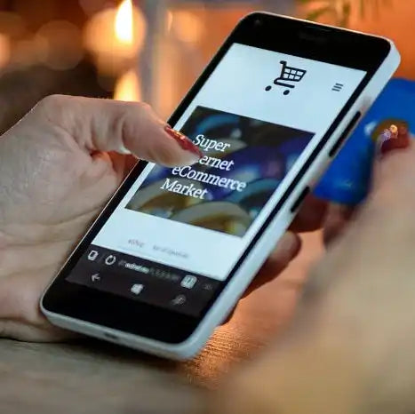 White smartphone displaying an e-commerce website.